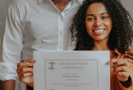 IT Certifications - A Couple Holding an Adoption Certificate