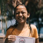 Certification - Girl Holding A Certificate