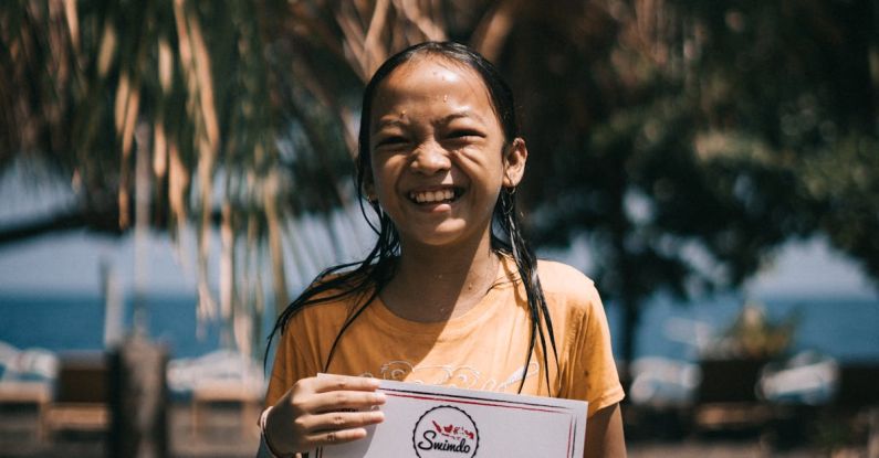 Certification - Girl Holding A Certificate