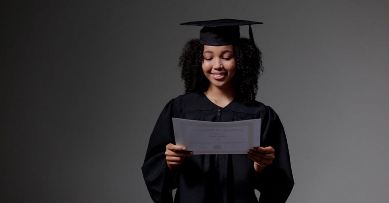Certifications - Curly-haired graduate student holding certificate
