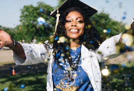 Graduate School - Woman Throwing Confetti