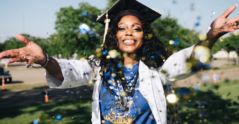 Graduate School - Woman Throwing Confetti