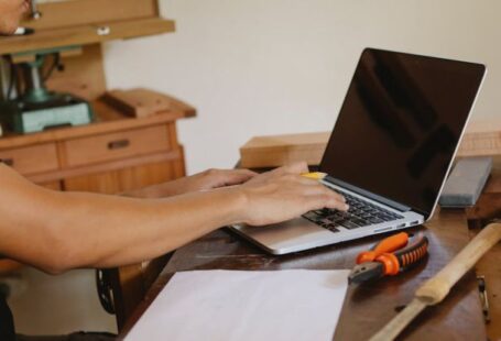 Master's Programs - Crop craftsman working on laptop in workplace
