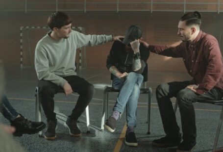 Peer Support - Men Consoling a Member of a Group Therapy