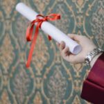 Degree - Person Holding Diploma