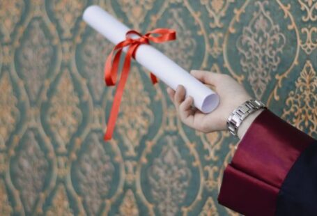 Degree - Person Holding Diploma