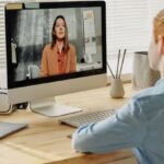Online Education - Photo of Child Sitting by the Table While Looking at the Imac