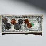 Scholarships - silver and gold round coins in box