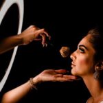 MBA - Woman Having Her Makeup Done in Front of a Ring Light 