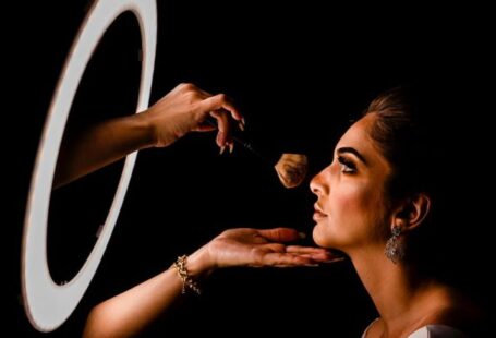 MBA - Woman Having Her Makeup Done in Front of a Ring Light 