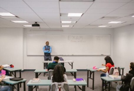 Proctored Examinations - Teacher Proctoring His Students During an Examination