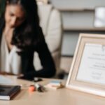 Certifications - Lady Justice Figurine on Wooden Table
